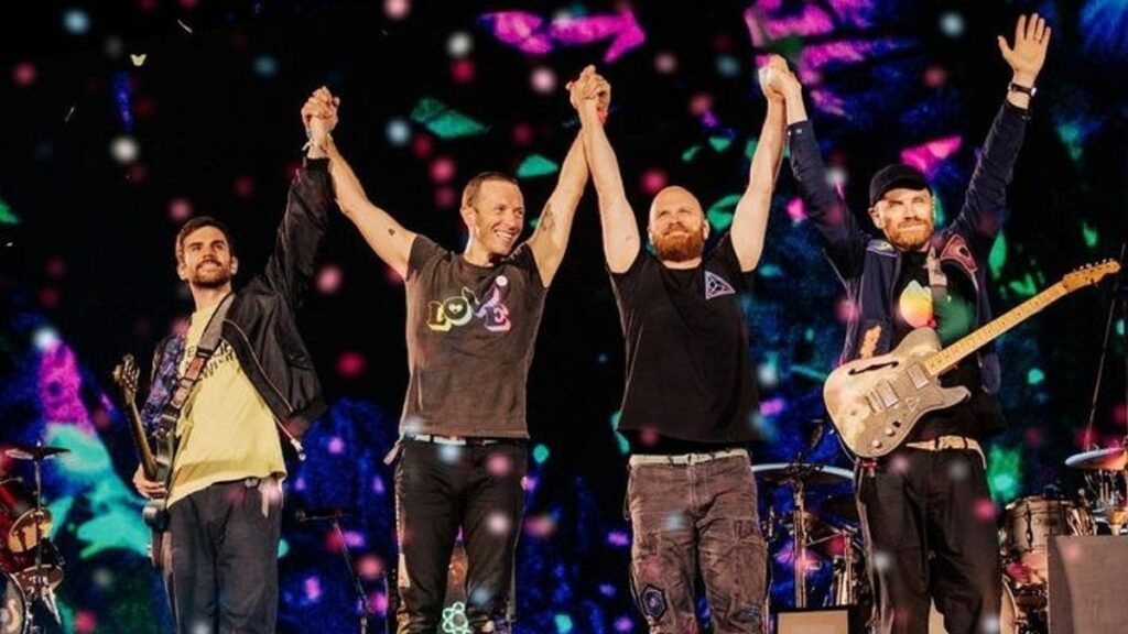 Coldplay's members doing celebration